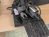 a keyboard and a mouse on a desk next to each other