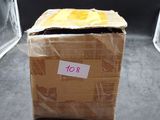 a box with a piece of paper on it and a pair of scissors