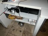 an image of a computer desk with a printer on top of it