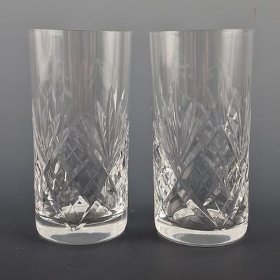 pair of crystal tumblers on a black background