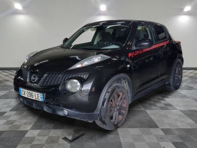 a picture of a black nissan juke suv parked in a garage