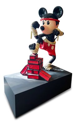 mickey mouse figurine on display on a white background