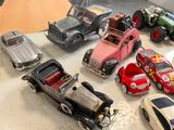 many toy cars that are sitting on a table