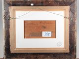 an old picture of a wooden frame with a piece of writing on it