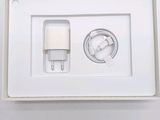 a picture of a white box with a charger attached to it