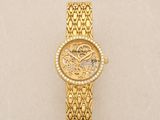 an image of a gold watch on a white surface