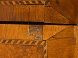 two pieces of wood that have been painted brown