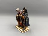 an image of a statue of a man and a woman on a pedestal