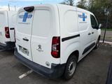 two white vans parked in a parking lot