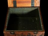 a wooden box with writing on the inside of it
