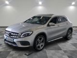 the mercedes gla suv is parked on a checkered floor