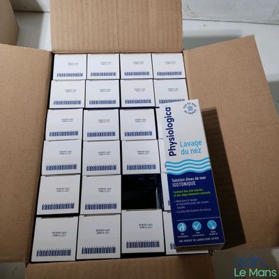 a cardboard box filled with a lot of white boxes