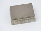 a silver box sitting on top of a white table