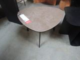 a table that has a black chair and a brown table