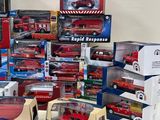 many different types of toy cars and trucks in boxes