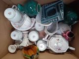 a box full of tea cups and saucers in it