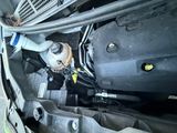a picture of a car engine with the hood open
