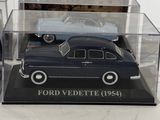two model cars in a display case on a white surface