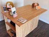 a wooden desk with a book shelf on top of it