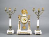 three different types of clocks on display on the table