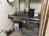 a small kitchen with a sink and a dishwasher