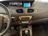 the interior of a car with a steering control and a dash board