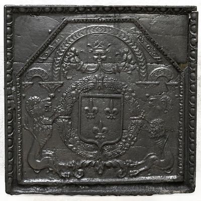 a close up of a metal plaque with a coat of arms on it