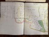 an open book with a map of a town on it