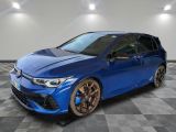 a blue toyota coroll is parked in a room with checkered floor
