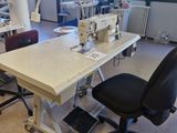 a sewing machine sitting on a table in a room