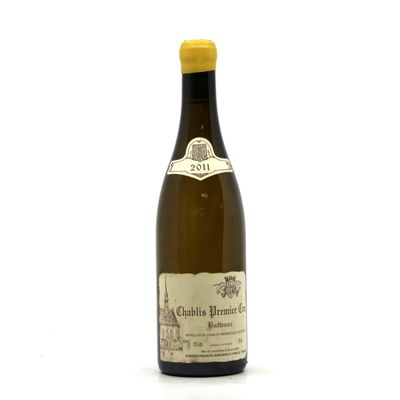 a bottle of wine that is sitting on a table