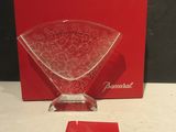 a red box that has a glass vase on it