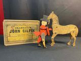 wooden toy of a horse and a box with a label on it