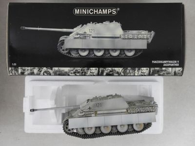 a box with a toy tank in it on a table