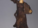 statue of a woman holding a musical instrument on a marble base