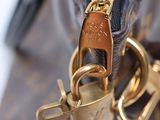 a close up of a purse with a lock on it