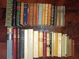 a lot of books that are sitting on a table