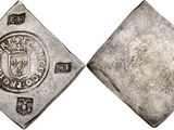 an old silver coin with a shield on the front and a shield on the back