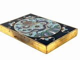 a small box with a decorative design on it