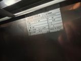 a close up of a sign on the side of a oven