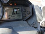 a close up of a motorcycle ' s dashboard with a clock on it