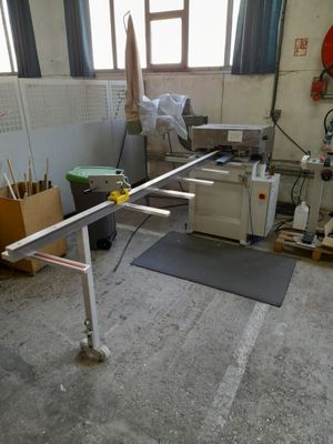 an image of a room that has a table and a chair in it