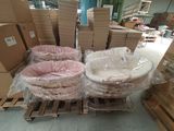 many boxes of baby cribs on pallets in a warehouse