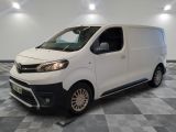 a picture of a white van on a checkered floor