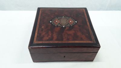 an old wooden box with a decorative design on it
