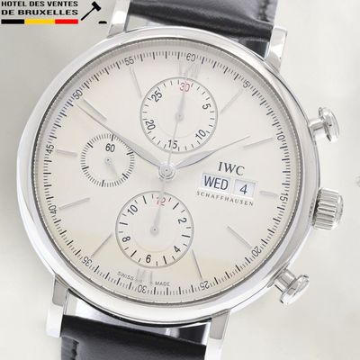 a close up of a wrist watch with a white dial