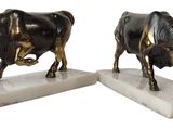 statue of a bull and a cow on a marble base