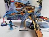 a box of legos and a toy plane on a table