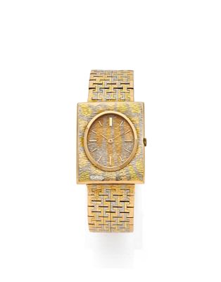 a close up of a gold watch with a white background