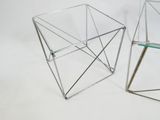 pair of chrome and glass side tables with a glass top